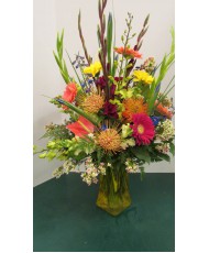 Vase Arrangement with Purples, Oranges, Blues and Yellows 