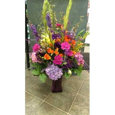 Vase Arrangement with oranges, hot pinks 