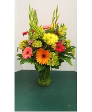 Vase Arrangement with Yellows, Oranges, Reds and Green 